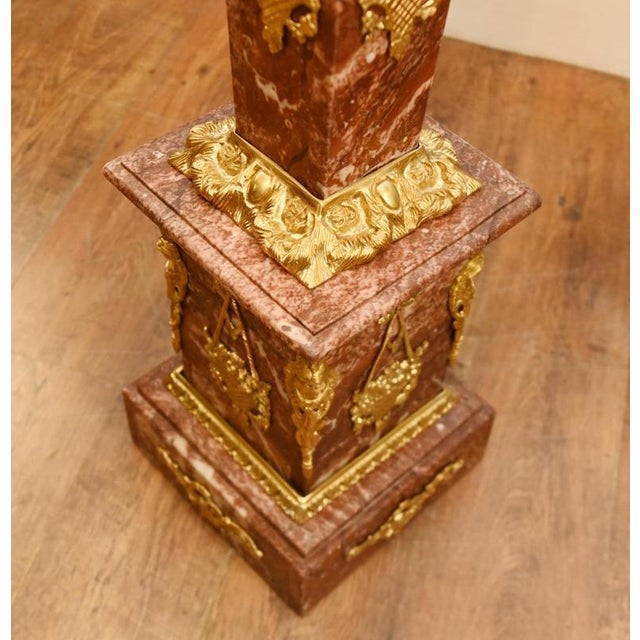 An exceptional pair of French Louis XVI Revival pedestal stands, dating to the late 19th century and crafted from richly...