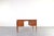 This Danish teak desk from the 1960s reflects the Scandinavian Modern style, which emphasizes functionality, clear...