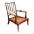 Victorian English armchair, circa 1880, made of hand-carved, wound mahogany. Seat with cane webbing and brass casters....