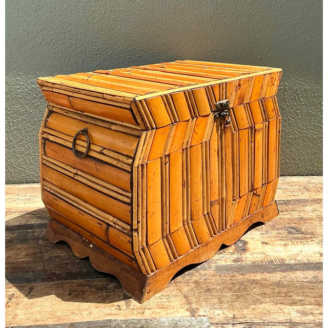 This striking vintage decorative chest showcases a unique faceted silhouette, expertly clad in hand-applied split rattan...