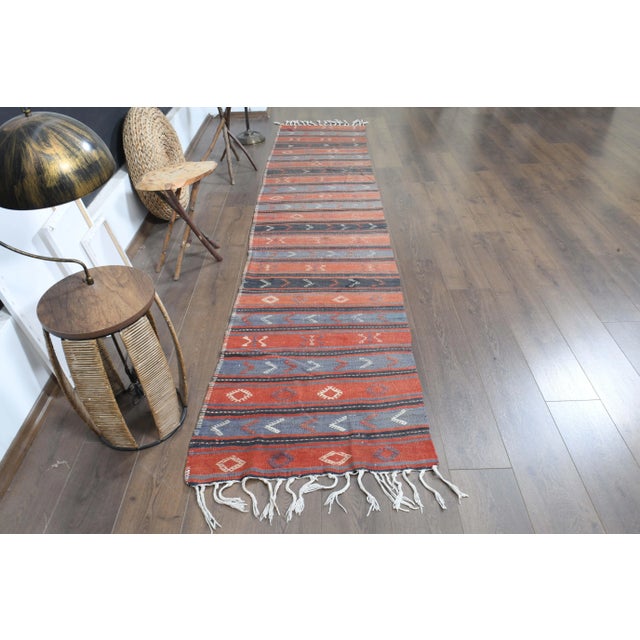 Vintage Turkish Hand-Knotted vintage rug is a semi- vintage runner rug.'70s Eastern region of Turkey's unique rug is...