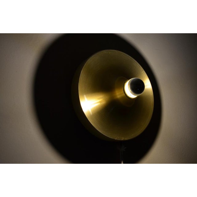 Les Arcs Lamp in Gold by Charlotte Perriand, in Good conditions. Designed 1960 to 1969 This piece has an attribution mark,...