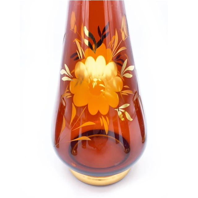 Vintage mid century ruby red and metallic gold, hand etched venetian glass decanter set. This ornate set was hand made and...