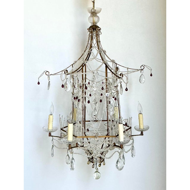 This spectacular vintage chandelier captures the essence of Chinoiserie elegance with its dramatic pagoda-inspired...
