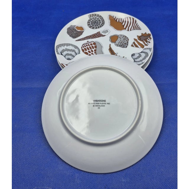 Add a touch of coastal charm to your table with this beautiful lot of three vintage 1979 Fitz & Floyd “Variations” shell...