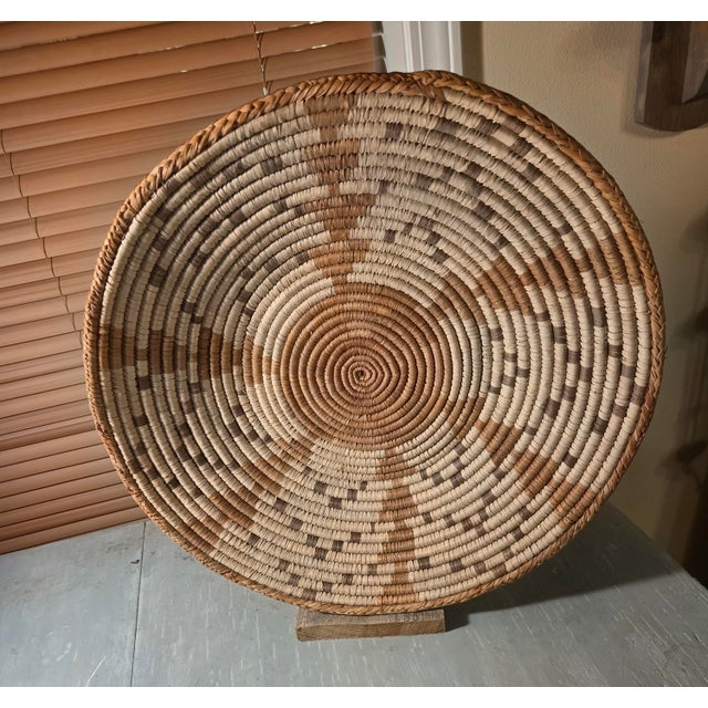 African coil weave trays from Zambia. The tray can be wall-art or serving tray. Geometrical Sunburst pattern. 17" diameter...