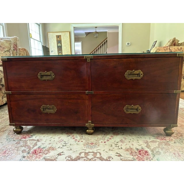 Substantial British Colonial / Campaign-style double-sided cocktail table purchased from ABC Carpet & Home in 1999. The...