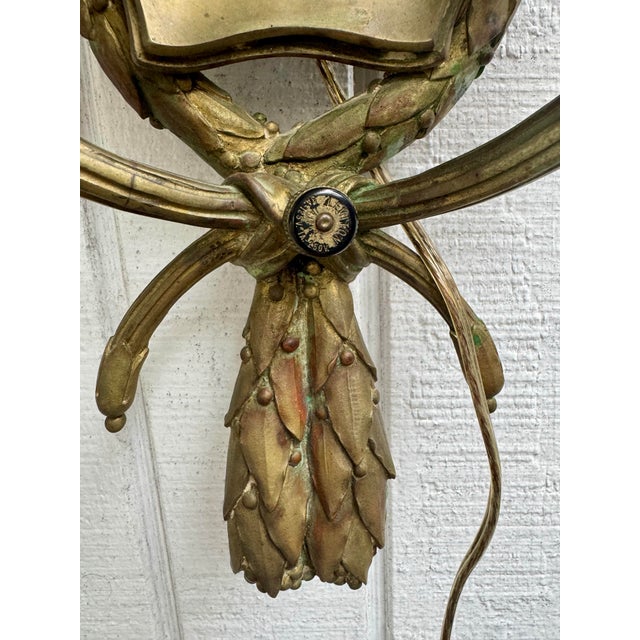 Antique Ornate Bronze French Empire Style Garland Sconce With Versace Style Sunface Detail For Sale - Image 4 of 7