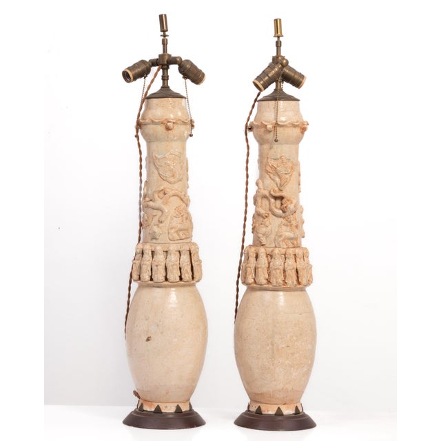 A pair of Chinese Song, Yuan Dynasty Qinghai funerary jars mounted as Lamps. The jars date from the 13th 14th century....