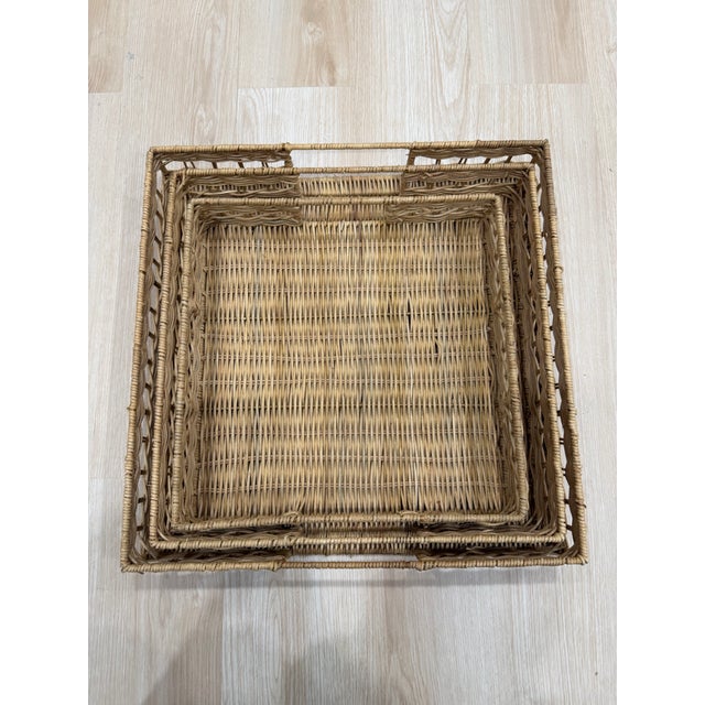 Set of three rattan square nesting trays. Dimensions: 16.5” Sq. large 14.5” Sq. med 12.5” Sq. small
