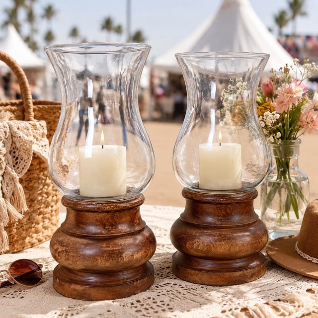 A handsome pair of vintage Italian hurricane candle holders featuring hand-turned hardwood bases topped with elegantly...