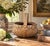 A quaintly scaled late-19th-century egg gathering basket, handwoven from narrow oak splints around a sturdy fixed bentwood...