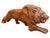 Striking vintage ceramic lion sculpture featuring a dynamic reclining pose and rich glossy brown glaze. The sculptor...