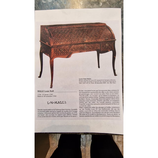 An elegant two-drawer rosewood commode topped with a grey Saint-Anne marble slab. The marquetry is made of rosewood veneer...