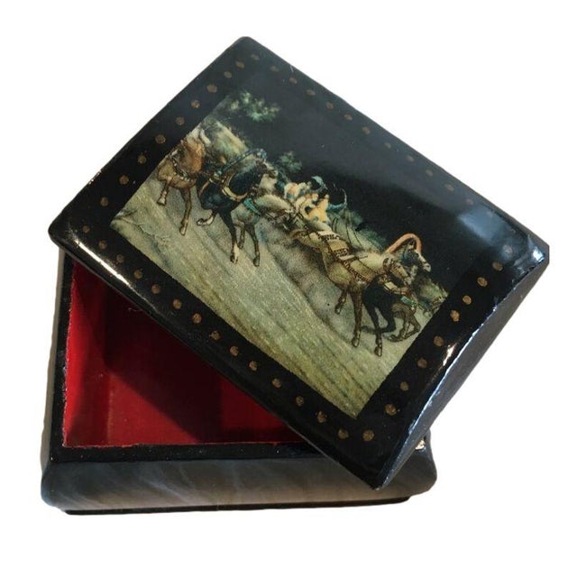This small black lacquer box from Russia 1990's is the perfect size for holding jewelry such as rings or earrings. The...