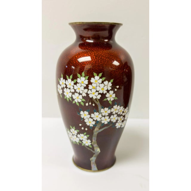 We are selling this pair of Japanese Ginbari red vases with cloisonne flowering tree decoration signed on the bottom...