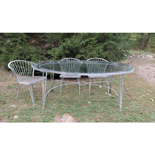 Woodard Pinecrest Patio Dining Set, 7 pieces. Table is 70.5" wide x 40.5" deep x 28.5" high. Table with glass which has...