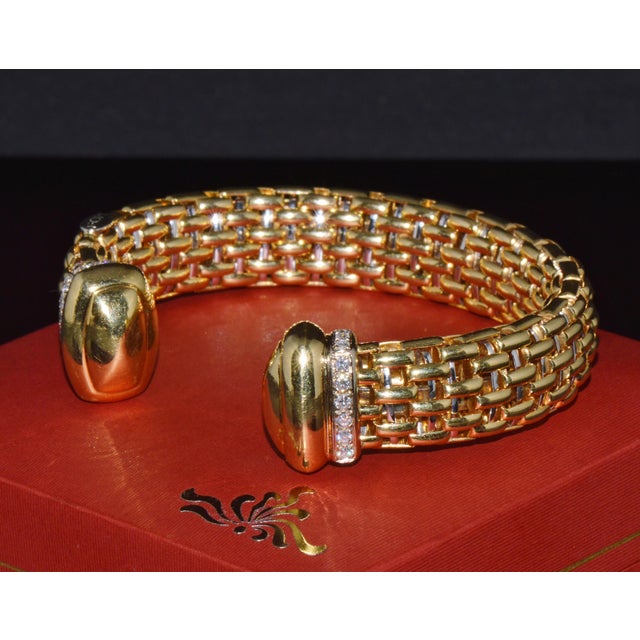 Authentic vintage FOPE Flex'it solid 18K yellow and white gold natural diamond open cuff bangle bracelet. This exceptional...