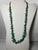 A bold Southwestern-style necklace featuring polished turquoise nuggets interspersed with round silver-tone metal beads....