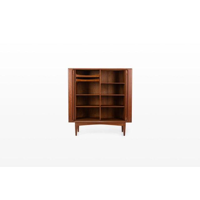 Beautiful danish highboard in teak wood produced by bernhard pedersen & son in the 1960s. This mid-century sideboard...