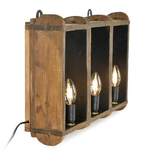 These light sconces are the result of a poetic transformation of old wooden brick molds, once used in artisanal factories....