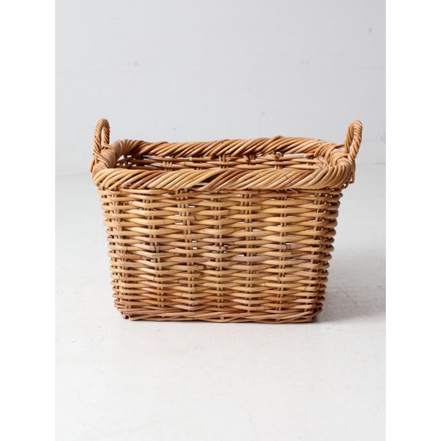 This vintage wicker basket offers timeless charm and practical storage. Handwoven with a classic design, it is sturdy yet...