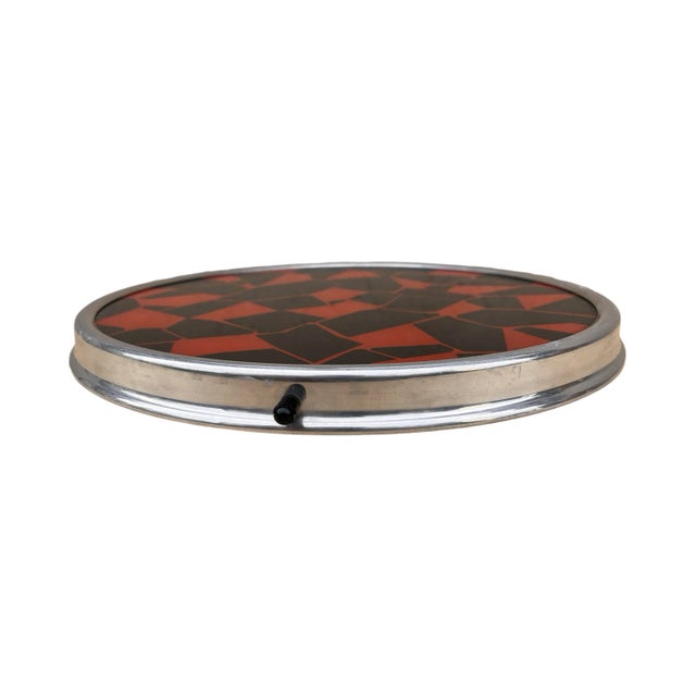Turntable, cake tin in mid-century modern style from around 1960. An item made of metal. The plate stands on a swivel...