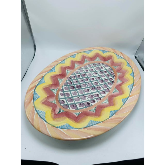 This large platter is stunning! Made by the incredible Mackenzie Childs, this piece is a highly collectible piece to cherish!