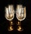 This set of four elegant large wine glasses feature clear, generous bowls paired with striking, reflective metallic...