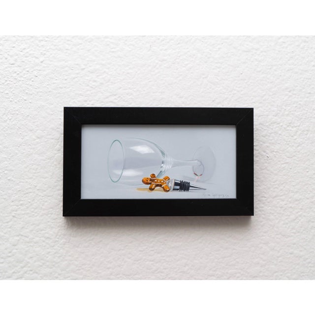 This oil on panel artwork features a delicately rendered still life, showcasing a tilted wine glass alongside a...