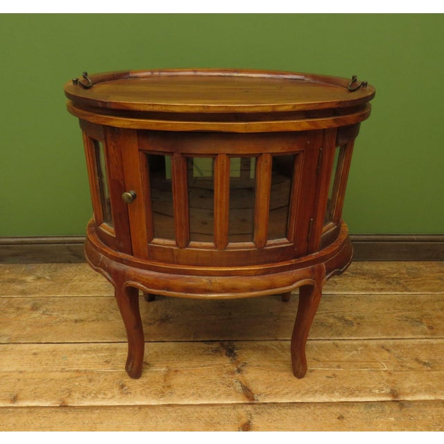 This is an unusual drinks cabinet which dates to the late 20th Century. It has rather a nautical look and is a useful...