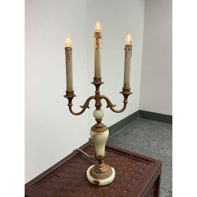 Design Plus Gallery presents a Vintage Neoclassical Alabaster Three-Light Candelabra Table Lamp. The sculptural body...