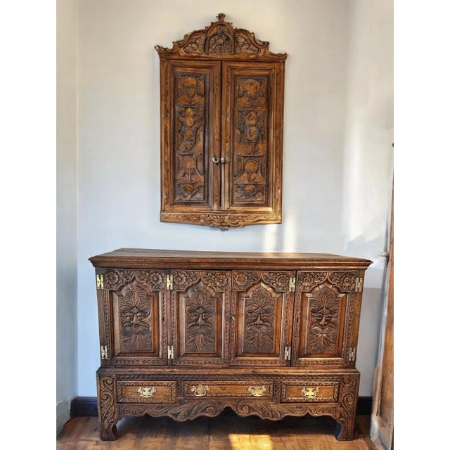 Carved 17th Century European Buffet 1 original keys Dimensions 58W x D22.5 x H41.5 This cabinet showcases the...
