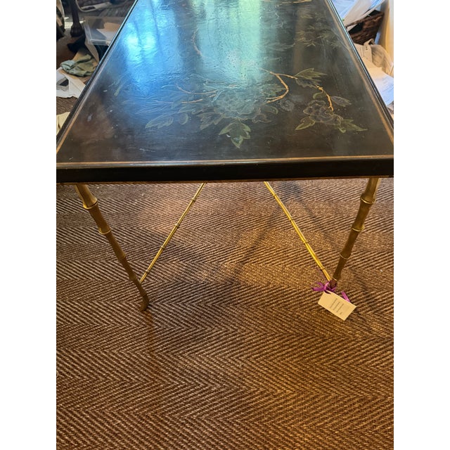 Although it does not have a label,This elegant coffee table was believed to have been made by Maison Meilleur in Paris in...