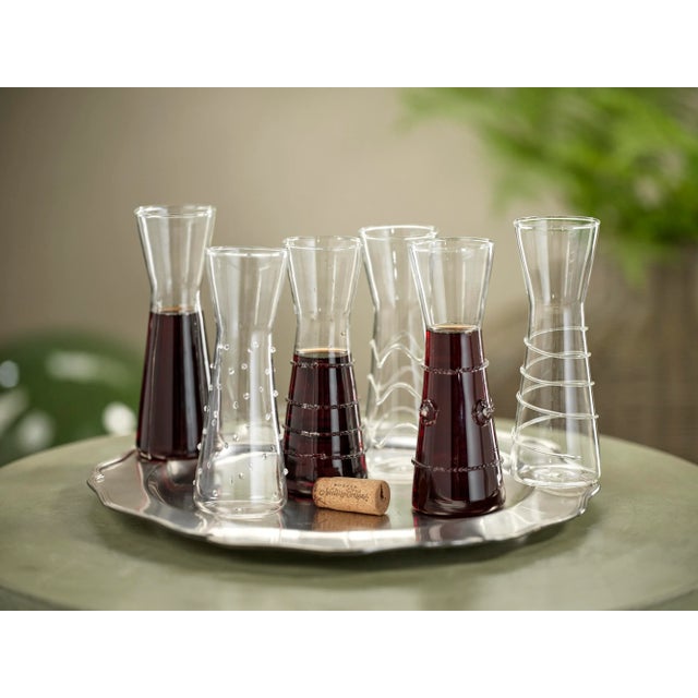 These single serve carafes are an elegant way to serve your favorite wine, juice or iced tea. These unique carafes with...