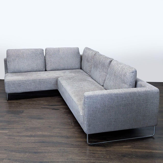 This Bensen Canyan sectional offers a clean, modern look with its gray fabric and sleek metal legs. The L-shape provides...