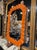 The Modern "Gucci" Orange Murano Glass Wave Mirror is a stylish and vibrant addition to any home decor. The vibrant color...