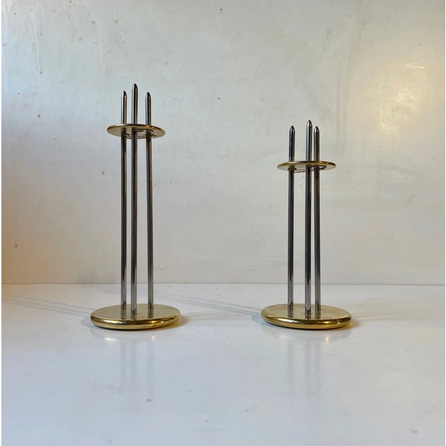 A set of height-adjustable candleholders for regular sized candles. Designed by the danish engineer Peter Seidelin Jessen...
