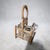 Charming antique French Provincial wooden wine bottle carrier featuring a tall pierced carrying handle, two circular...