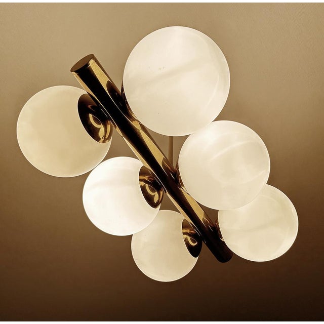Large vintage stilnovo style pendant light, very rare design featuring a brass beam with 6 opaline glass globe shades Very...