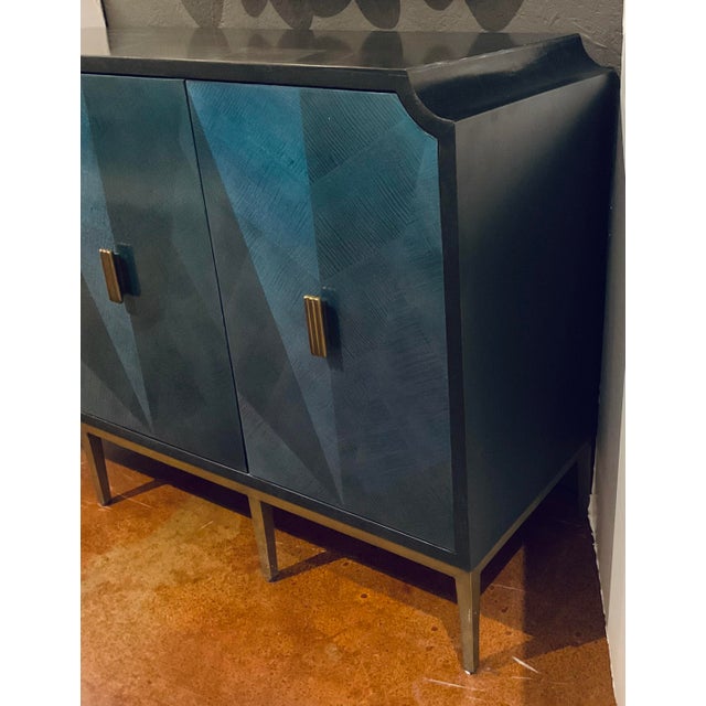 Original retail $5220, timeless Currey & Co. Modern Blue Wood Kallista Cabinet, brass base and pulls, black lacquer side...