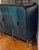 Original retail $5220, timeless Currey & Co. Modern Blue Wood Kallista Cabinet, brass base and pulls, black lacquer side...