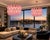 Chandelier featuring a circular metal frame with a gold finish, suspended from a matching chain. The light fixture is...