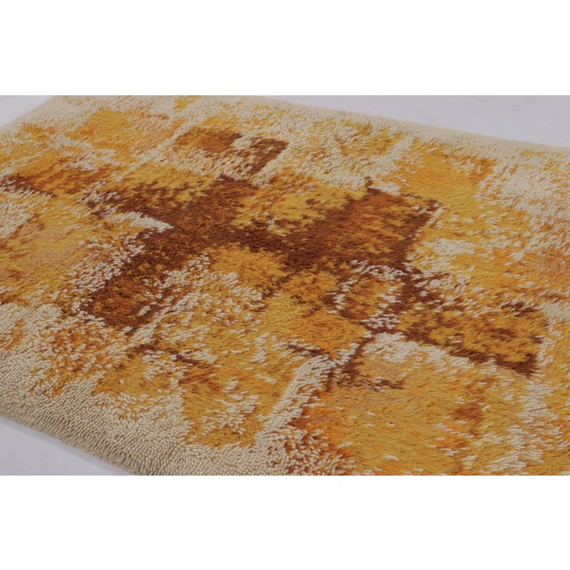 Hand-knotted in high-pile wool in Sweden circa 1960-1970, this 7x9 vintage Swedish Rya rug is a bold new addition to Rug &...