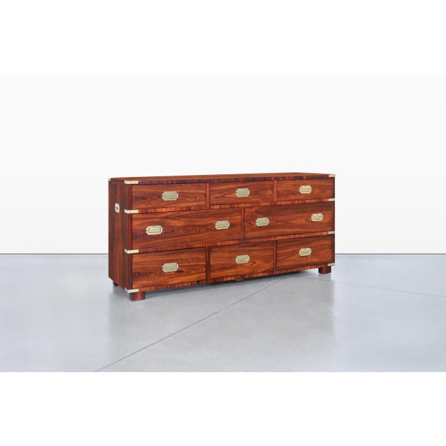 A stunning vintage rosewood campaign dresser, a true gem from the renowned John Stuart of New York, crafted in the 1960s....