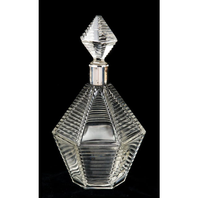Very fine quality French cut-glass hexagonal decanter with step-cut and plain triangle patterns with matching cut stopper,...