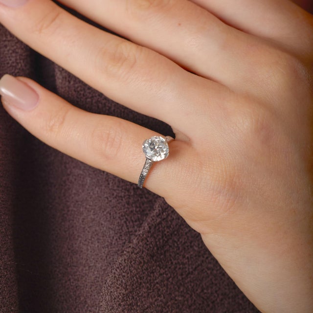 This authentic Art Deco engagement ring is a beautiful reflection of 1930s sophistication, where refined geometry and...