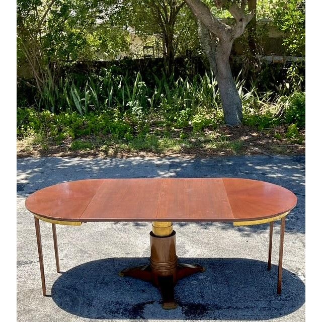 Embrace timeless elegance with this vintage round Jules Lelue dining table, featuring a smart extendable design perfect...