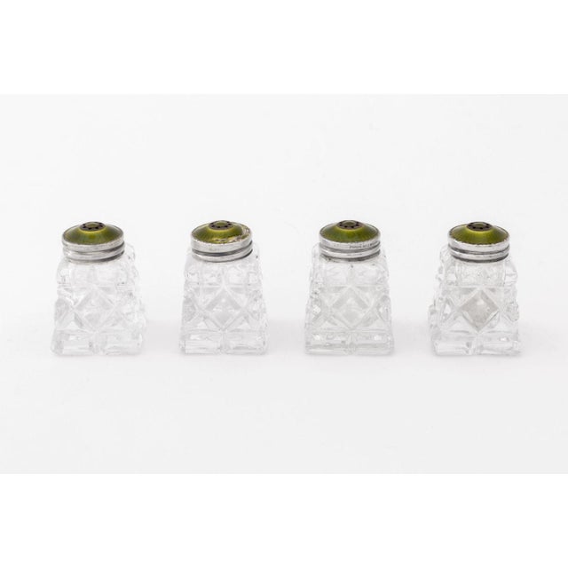 Set of Four Norwegian Sterling Silver and Cut Glass Salt and Pepper Shakers, the lids with green guilloche enamel and...