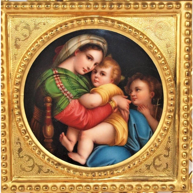An antique carved gold gilded wood frame with a hand painted tile of The Madonna della Seggiola after Raffaello Sanzio,...